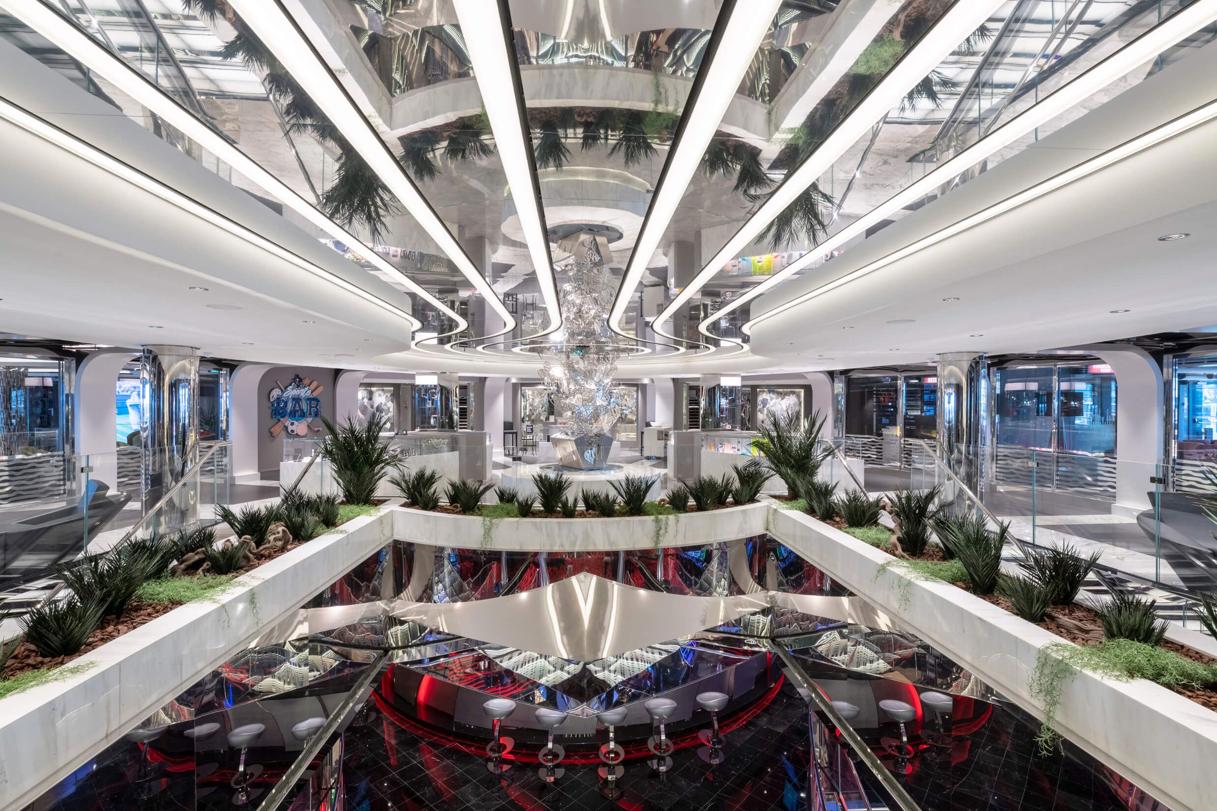 Elegante Lounge mit modernen Spiegeln, Pflanzen und stilvollem Design. Ein einladender Ort zum Entspannen.